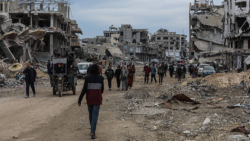 Palestinians inspect the destruction after the Israeli army withdrew from the Netzarim corridor, as part of a ceasefire agreement with Hamas in Gaza City, February 9, 2025. /VCG