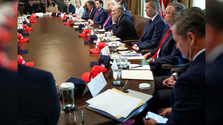 U.S. National Security Advisor Mike Waltz checks his mobile phone while attending a cabinet meeting held by U.S. President Donald Trump at the White House in Washington, D.C., U.S., April 30, 2025. /Reuters