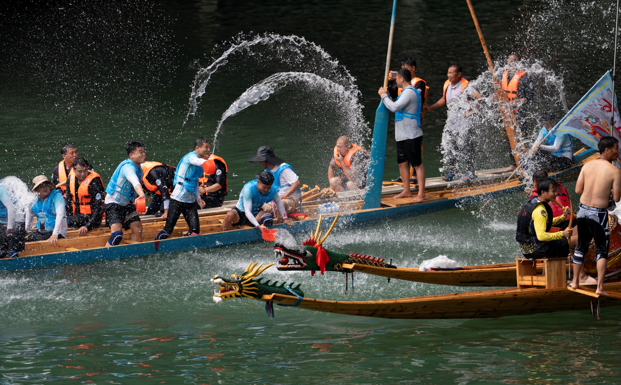 People engage in a playful water-splashing tradition during the 